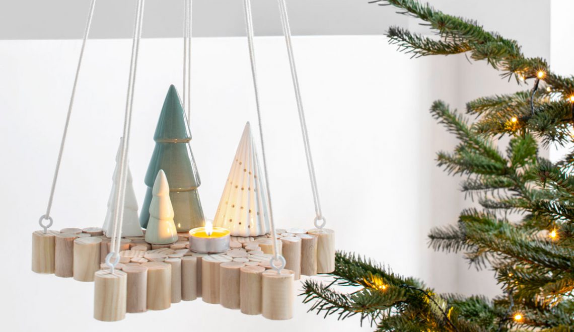 Kerst DIY: een hangende ster van houten stokken